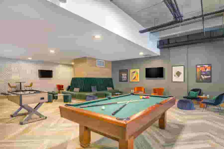Game Lounge with pool table, foosball, and lounge seating